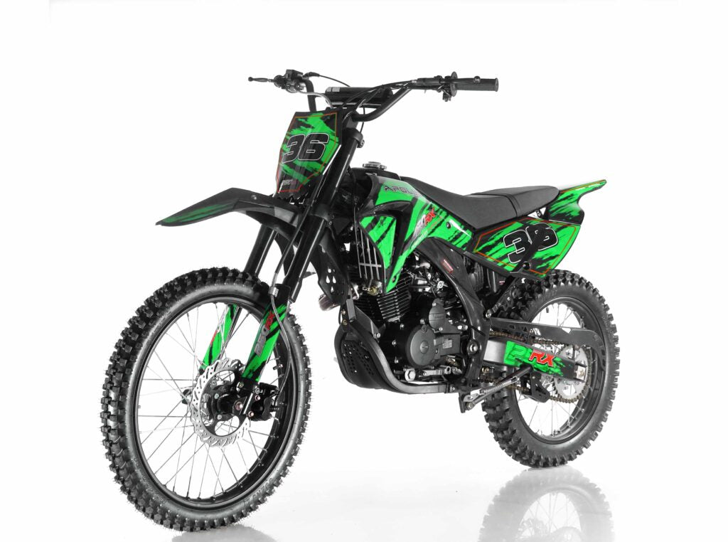 Green and black dirt bike on a white background